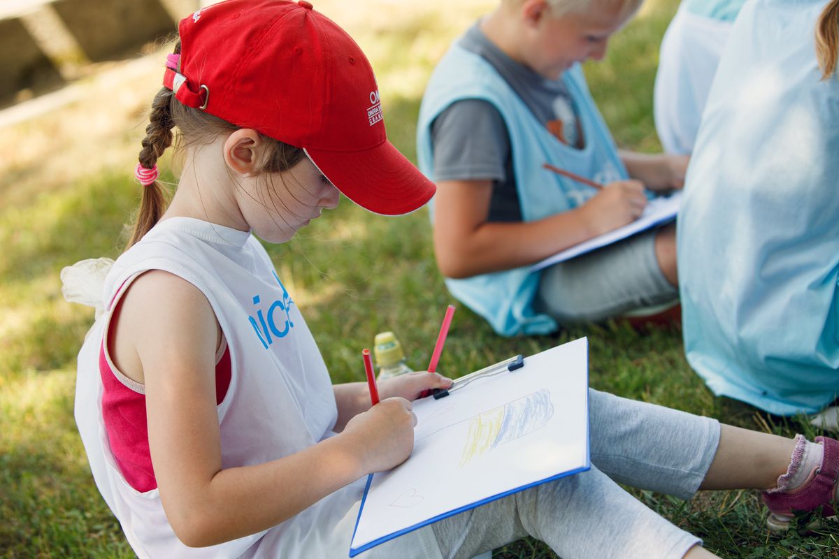 SEREDNIE, UKRAINE - JUNE 19, 2022 - A girl draws during a session with a psychologist as part of the Poruch project a joint initiative of the United Nations Children's Fund (UNICEF) and Ukraine's Ministry of Education and Science to support children, youth and their families affected by the Russian invasion of Ukraine through sport, Serednie urban-type settlement, Zakarpattia Region, western Ukraine. This photo cannot be distributed in the Russian Federation. (Photo credit should read Serhii Hudak/ Ukrinform/Future Publishing via Getty Images)