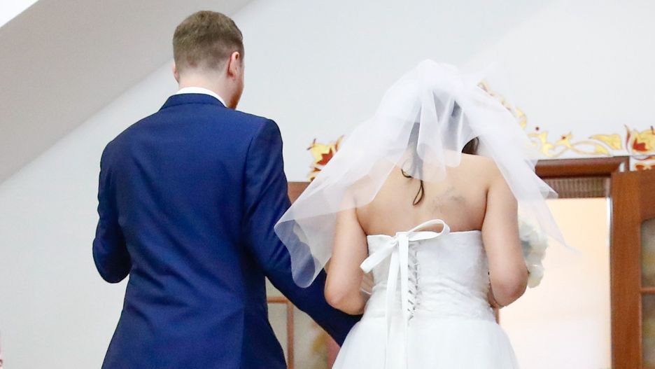 A couple during their wedding ceremony