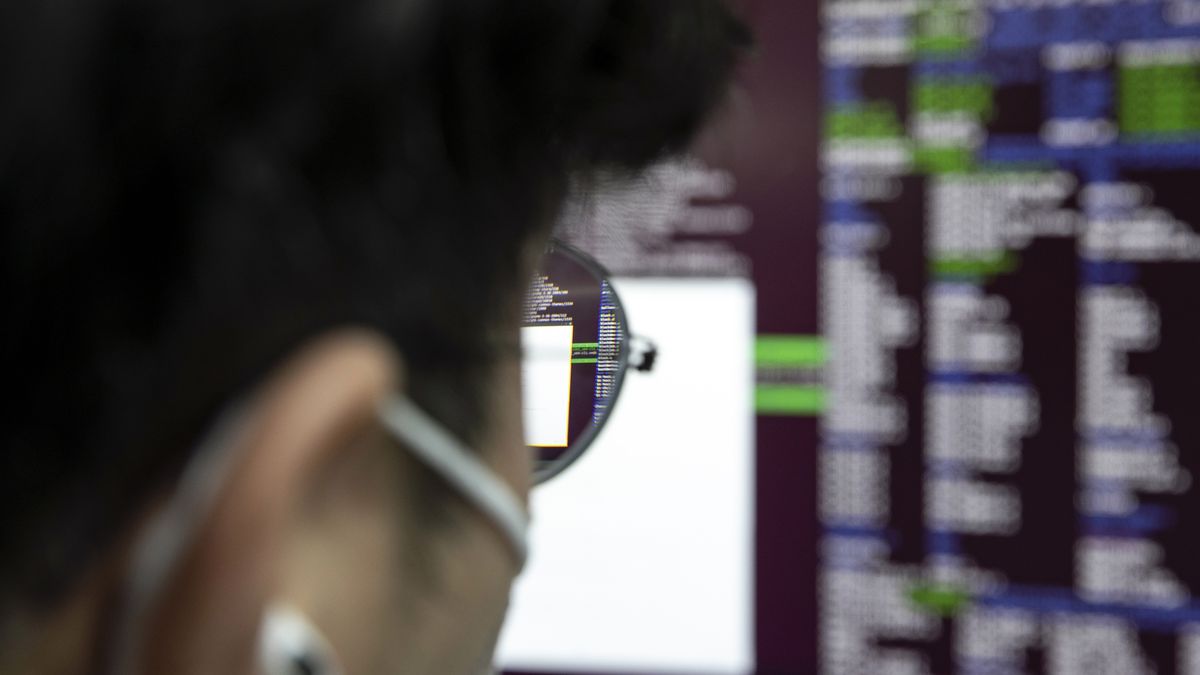 An employee at his desk at S2W Inc., a South Korean cybersecurity company, in Pangyo Techno Valley, Seoul, South Korea, on Wednesday, Aug. 17, 2022. The majority of S2W workers have expertise in North Korea, and they work with international law enforcement to thwart North Korean hacking attempts. The company also has private-sector clients in e-commerce, automotive, semiconductors, and biotech. Photographer: Woohae Cho/Bloomberg via Getty Images