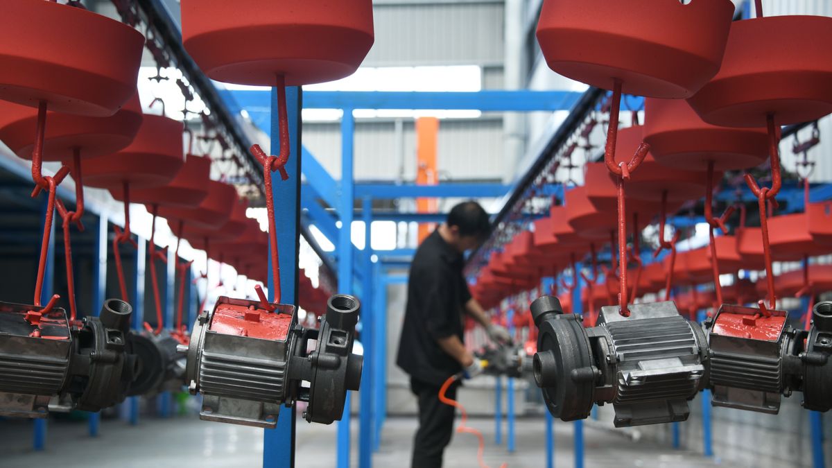 ENSHI, CHINA - JULY 18: An employee works on the production line of water pumps at a workshop to meet overseas orders on July 18, 2025 in Xuan'en County, Enshi Tujia and Miao Autonomous Prefecture, Hubei Province of China. (Photo by Wang Jun/VCG via Getty Images)