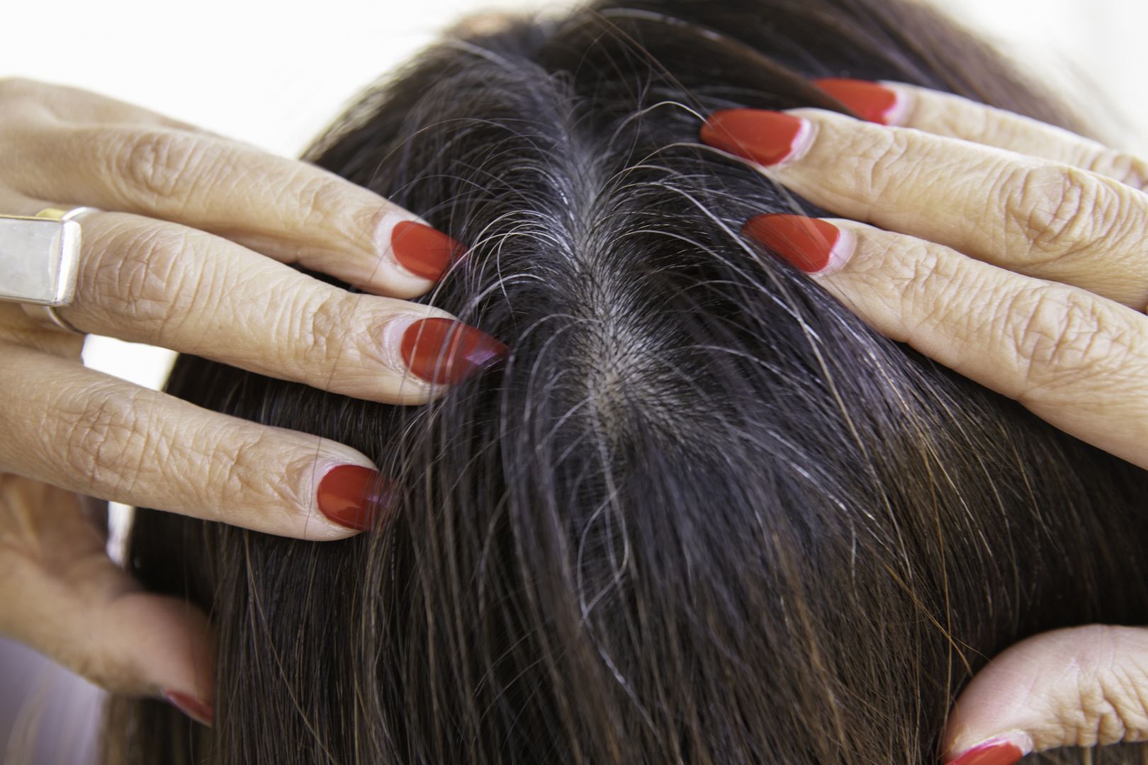 Checking for gray hair
Close of the hair of a woman checking for grey hair.
Marcus Lindstrom