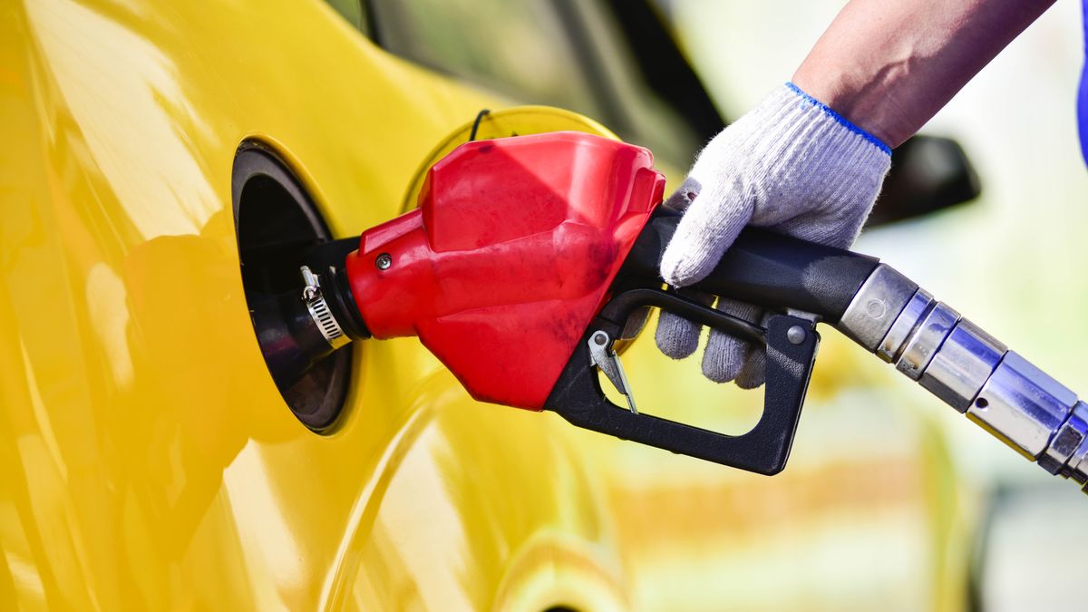 QINGZHOU, CHINA - MARCH 31, 2023 - A worker fills up a car at a gas station in Qingzhou, East China's Shandong Province, March 31, 2023. According to recent changes in international oil prices, domestic gasoline and diesel prices will be lowered by 335 yuan per ton and 320 yuan per ton, respectively, starting at 24 o 'clock on March 31, 2023, according to the current pricing mechanism for refined oil products, the National Development and Reform Commission said. (Photo credit should read CFOTO/Future Publishing via Getty Images)