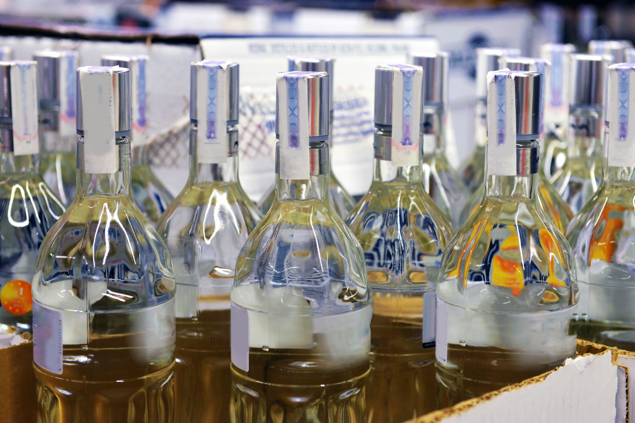 Vodka in a cardboard box in the store
alcohol, beverage, bottle, box, buy, case, celebration, drink, event, glass, market, marketplace, merchandise, product, retail, row, sale, sell, service, shelf, shop, store, supermarket, trade, vine, vodka, white, wine, winery
