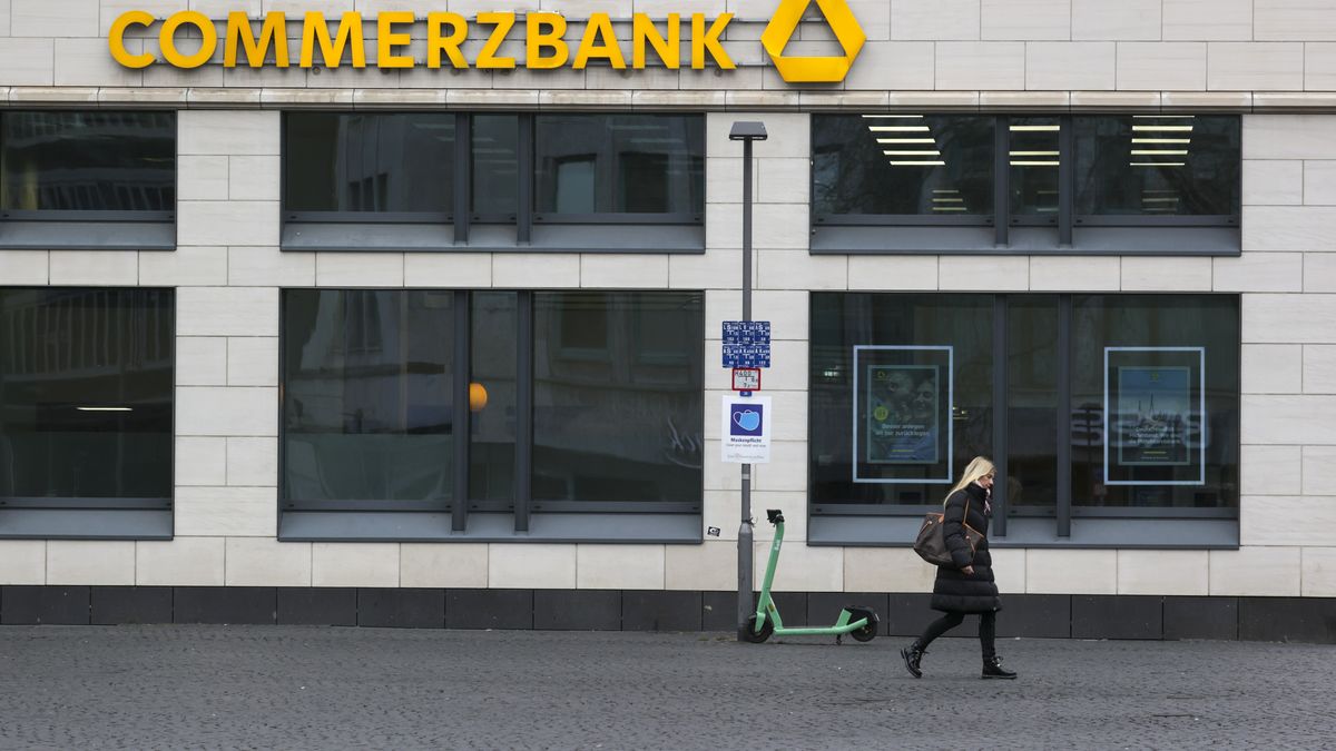 A pedestrian passes an electric scooter outside a Commerzbank AG bank branch in Frankfurt, Germany, on Monday, Jan. 24, 2022. Commerzbank, which expects to make a profit this year in a boost for Chief Executive Officer Manfred Knof as he pushes ahead with his turnaround plan, is scheduled to release earnings on Feb. 17. Photographer: Alex Kraus/Bloomberg via Getty Images