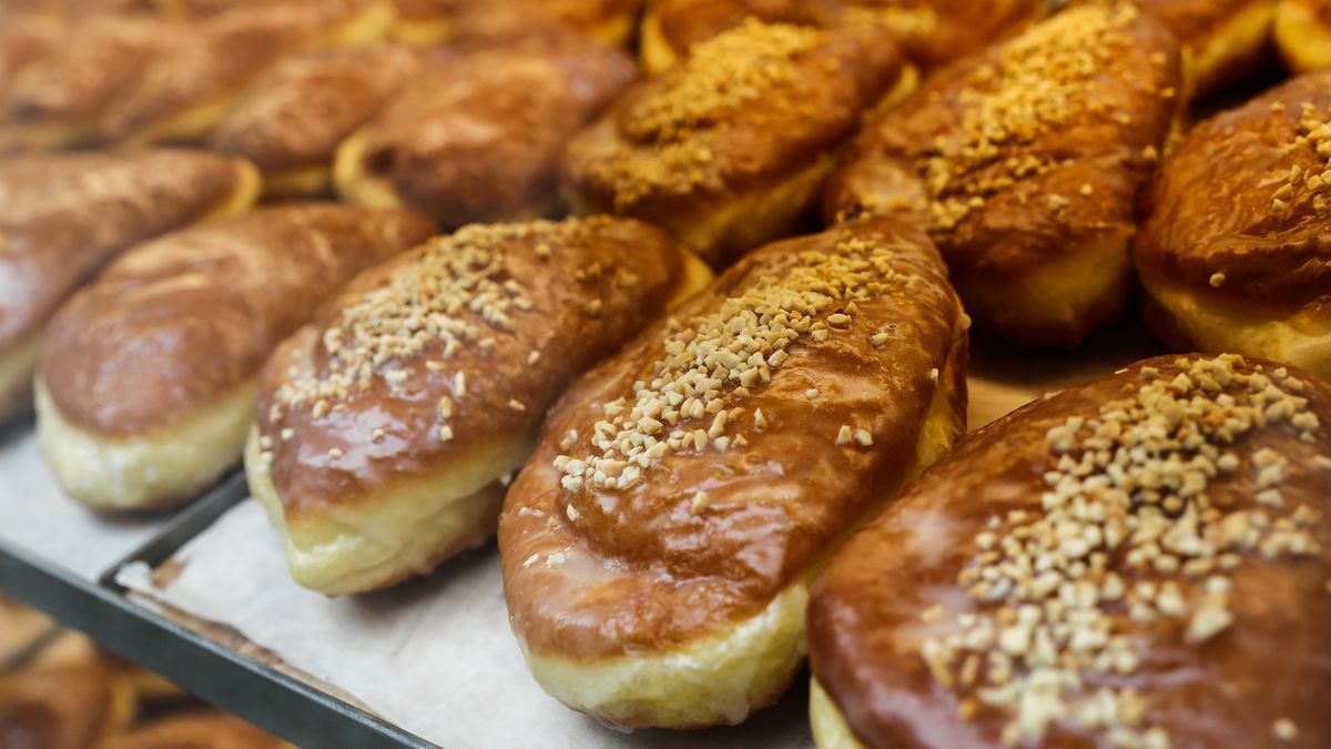 Filled doughnuts called Paczki are seen in a storefront in Krakow, Poland on May 25, 2022. (Photo by Jakub Porzycki/NurPhoto via Getty Images)