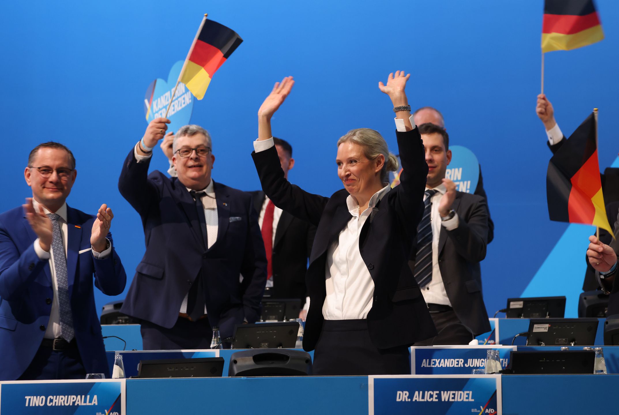 RIESA, GERMANY - JANUARY 11: Alice Weidel (C), co-leader of the far-right Alternative for Germany (AfD) political party, waves after delegates at the AfD party congress confirmed Weidel as the party's chancellor candidate on January 11, 2025 in Riesa, Germany. Germany is scheduled to hold snap parliamentary elections on February 23 following the collapse of the three-party federal government coalition last November. (Photo by Sean Gallup/Getty Images)