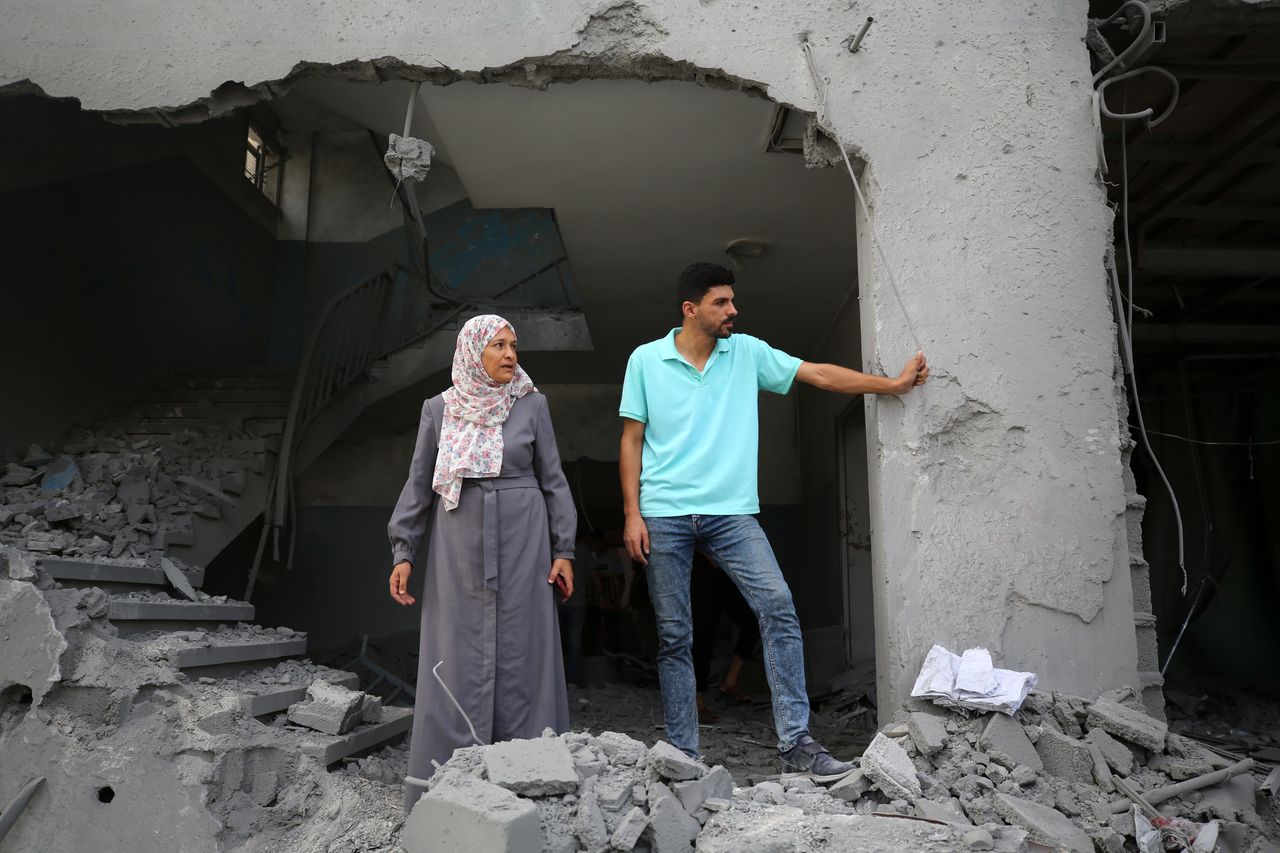 Palestinians are standing on the rubble of Abdullah Azzam Mosque, destroyed in Israeli bombardment in Nuseirat, central Gaza Strip, on July 17, 2024, amid the ongoing conflict between Israel and the Palestinian Hamas militant group. (Photo by Majdi Fathi/NurPhoto via Getty Images)