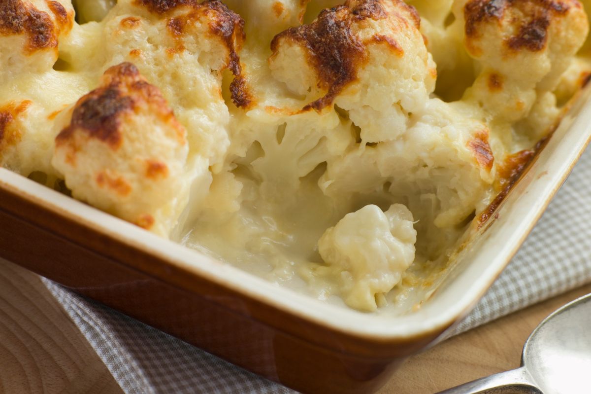 Roasted cauliflower in cheese sauce.