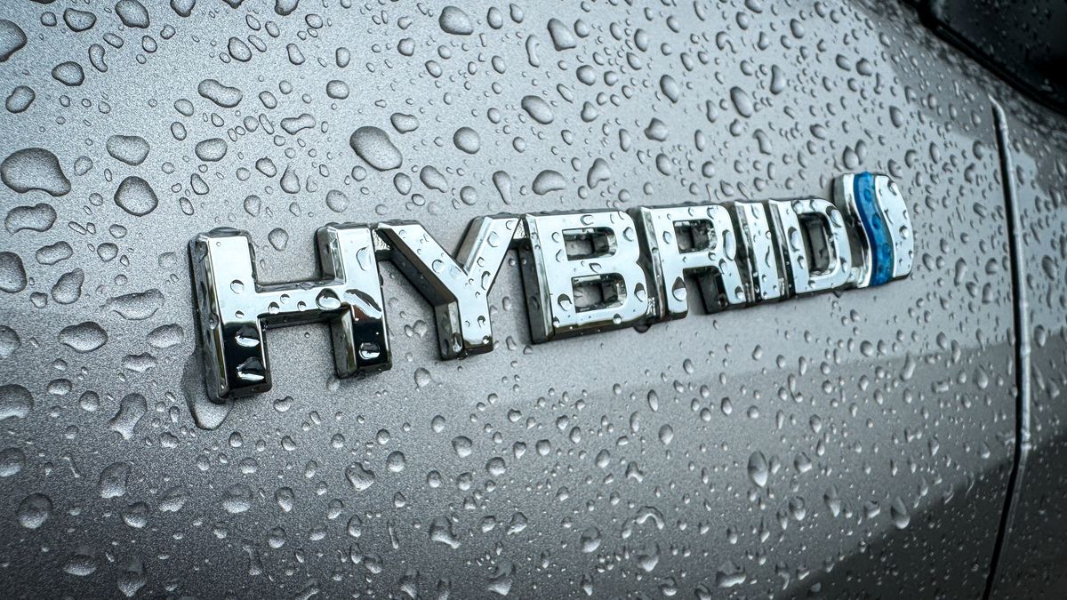 MORZINE, FRANCE - APRIL 04: Rain drops gather on the hybrid badge on a car in the village of St Jean d'Aulps on April 4, 2024 near Morzine, France. The European Union plans to ban all new sales of carbon-emitting petrol and diesel cars by 2035. Originally the UK planned to ban the sale of new petrol and diesel cars in Britain will by 2030, however this has recently put back still further. Critics of the laws have expressed concern that many internal combustion engined carbon polluting cars, lorries and vans will be still on the roads long after the ban on their sale. (Photo by Matt Cardy/Getty Images)