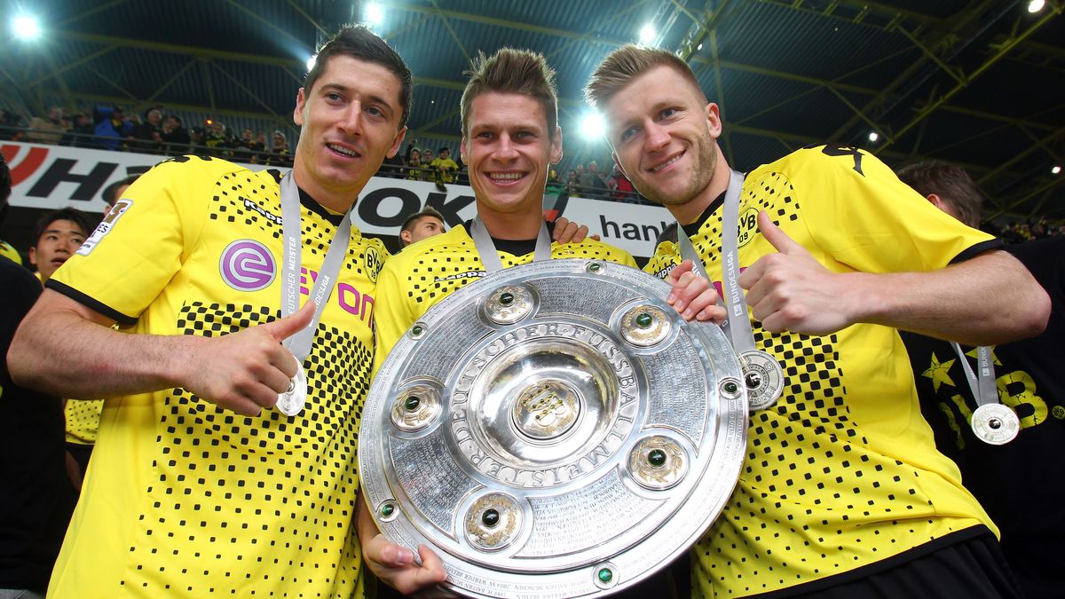 Robert Lewandowski, Łukasz Piszczek i Jakub Błaszczykowski po zdobyciu mistrzostwa Niemiec 2011