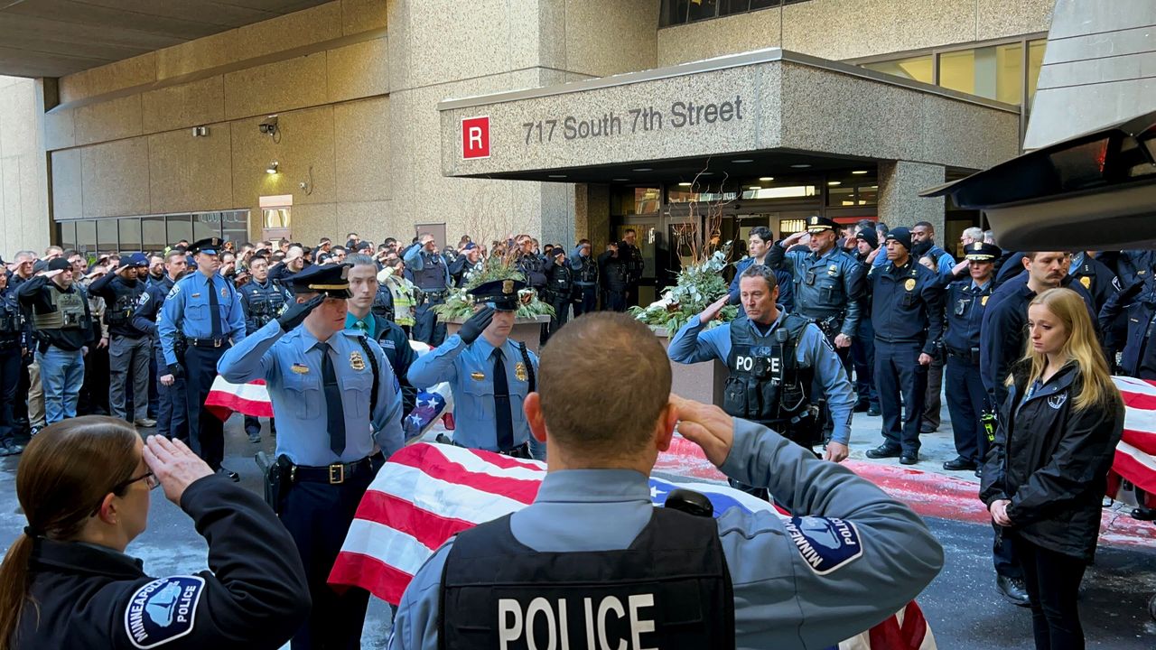 MINNEAPOLIS, MN. - FEBRUARY 2024: Law enforcement officials saluted as the bodies of two slain police officers and a medic were transported to the Hennepin County Medical Examiner's office in downtown Minneapolis, Minn. on Sunday, February 18, 2024. The two Burnsville, Minn. police officers, Matthew Ruge and Paul Elmstrand, and Fire Department paramedic, Adam Finseth, were killed after responding to a domestic abuse call on Sunday, February 18, 2024 in Burnsville, Minn. 
 (Photo by Liz Sawyer/Star Tribune via Getty Images)