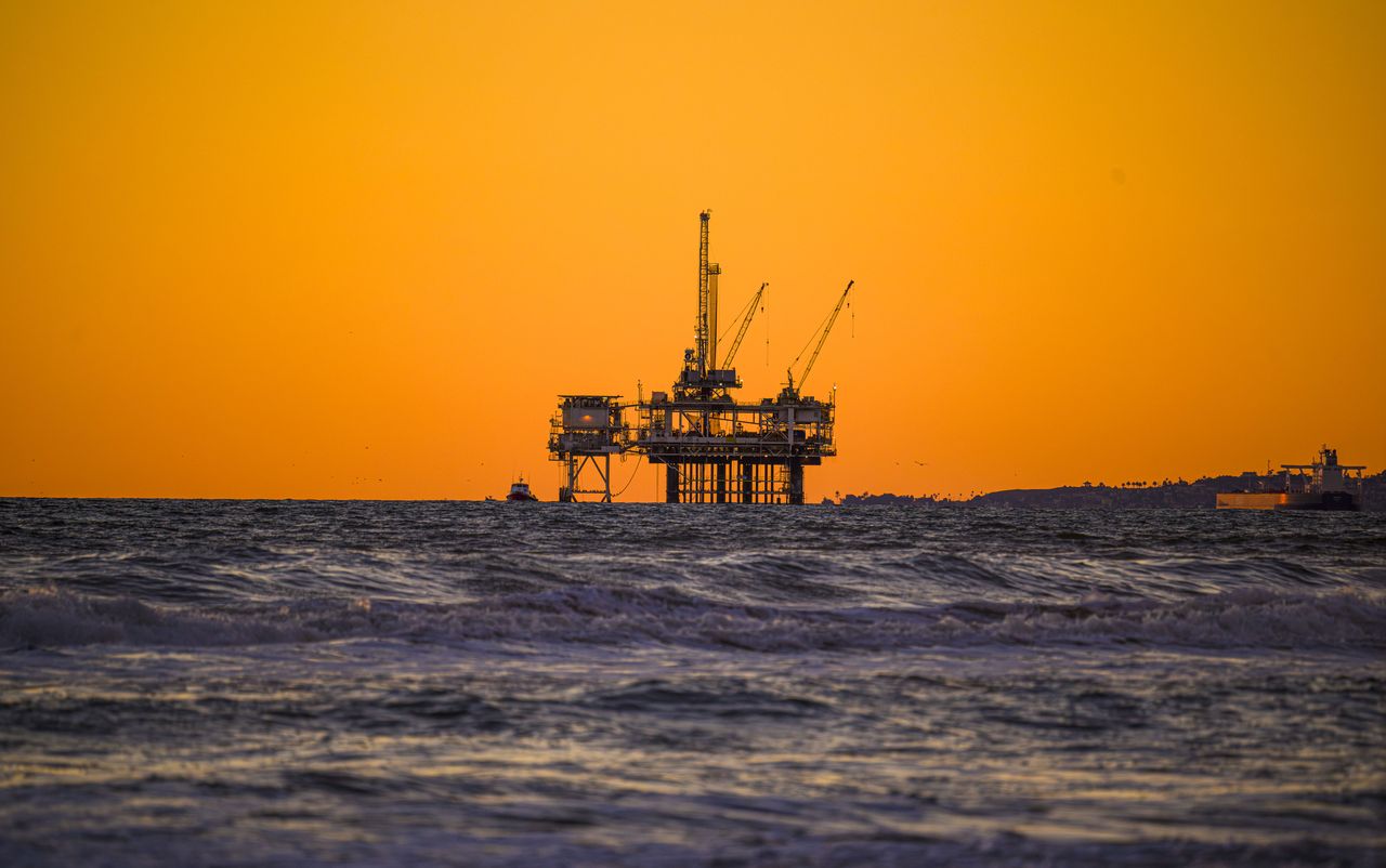 HUNTINGTON BEACH, CA - JANUARY 08: An off-shore oil platform can be seen in the distance at sunset from the Huntington Beach Pier in Huntington Beach on Monday, January 8, 2024. (Photo by Leonard Ortiz/MediaNews Group/Orange County Register via Getty Images)