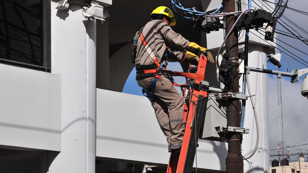 Person, man, working, post, electricity, energy, 2015. (Photo by: AGB Photo Library/Universal Images Group via Getty Images)