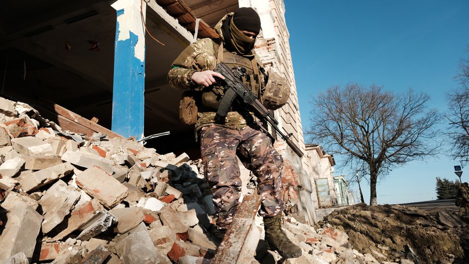 KUPIANSK, UKRAINE - JANUARY 23: Ukrainian soldiers walk over rubble in a destroyed building after testing a drone on January 23, 2023 in Kupiansk, Ukraine. Kupiansk was occupied by Russian forces mere days after their February 24th invasion of Ukraine, a process hastened by the surrender of Kupiansk's Russia-friendly mayor. Ukrainian forces liberated the town in September, but Russia turned its artillery on Kupiansk while in retreat, causing widespread destruction. (Photo by Spencer Platt/Getty Images)