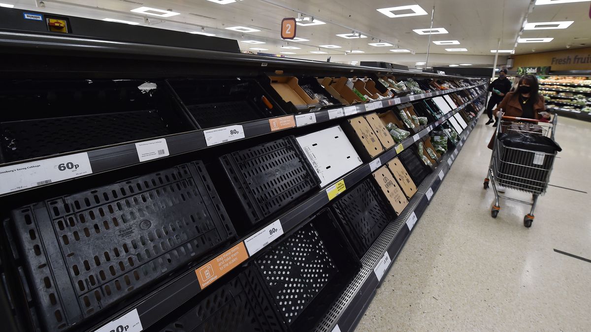 BELFAST, NORTHERN IRELAND - JANUARY 14: Shoppers look at sparse shelves in Sainsburys on January 14, 2021 in Belfast, Northern Ireland. Supermarkets here are already seeing disruption to food supplies after the end of the Brexit transition period on December 31st, when Northern Ireland remained part of the E.U. single market while GB left. The change will require food products entering NI from Great Britain to receive additional certification and checks at ports. Despite a three-month "grace period," in which supermarkets needn't comply with all EU certification requirements, shoppers are already seeing disruption as supermarkets grapple with the changes. (Photo by Charles McQuillan/Getty Images)