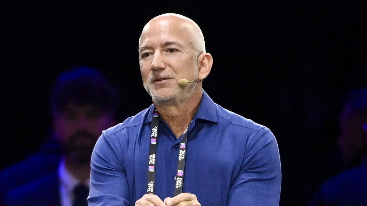 TURIN, ITALY - OCTOBER 3: Jeff Bezos Amazon's founder speaks with John Elkann Stellantis' Chairman on stage during the Italian Tech Week 2025 at OGR Officina Grandi Riparazioni on October 3, 2025 in Turin, Italy. (Photo by Stefano Guidi/Getty Images)