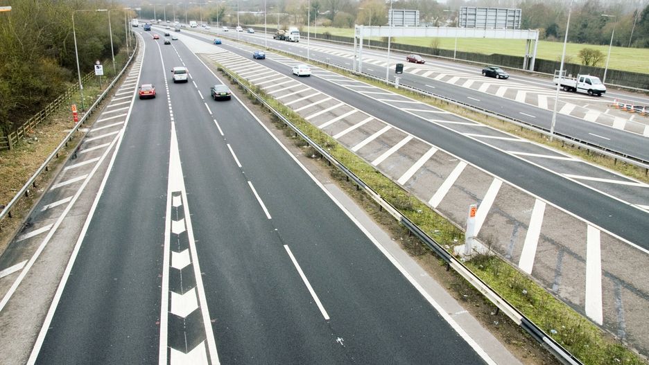SPL RM HD
Motorway junction. At left is the slip road leading from the clockwise (A) carriageway of the M25 motorway onto the south-westbound (A) carriageway of the M3 motorway. The M3 (both carriageways seen at right) is part of the UK motorway network, and runs from Sunbury-on-Thames, Surrey, to Southampton, Hampshire. The M25 is the orbital motorway surrounding Greater London. The two motorways meet at junction 2 of the M3, which is also junction 12 of the M25. This photograph was taken from Lyne Lane.
TRL LTD.