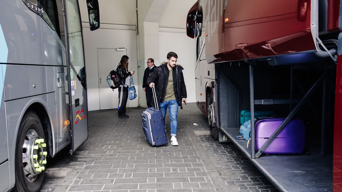 MADRID, SPAIN - FEBRUARY 08: A boy without a mask places his luggage in the trunk of a coach at the Estacion Sur de Autobuses Mendez Alvaro, on February 8, 2023, in Madrid, Spain.The use of masks in public transport in Spain ceases to be mandatory today, once published in the Official State Gazette (BOE) the modification of the Royal Decree of April 19, 2022 that approved yesterday Tuesday, February 7, the Council of Ministers. With the new measure, the mask is only mandatory in hospitals, health centers, dental clinics, assisted human reproduction centers, voluntary interruption of pregnancy centers and pharmacies. The withdrawal of masks in transport comes almost a year after their use ceased to be mandatory outdoors. (Photo By Carlos Lujan/Europa Press via Getty Images)