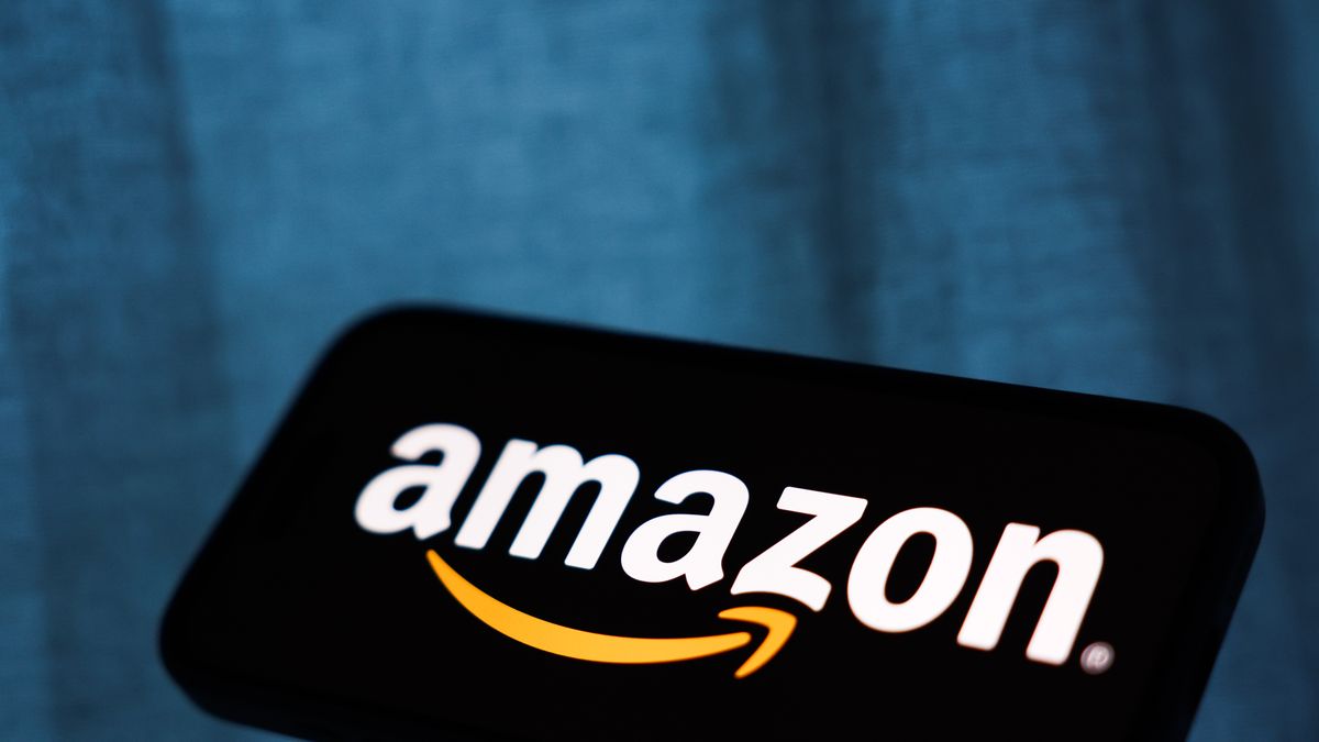 Amazon logo displayed on a phone screen is seen in this illustration photo taken in Krakow, Poland on December 23, 2025. (Photo by Jakub Porzycki/NurPhoto via Getty Images)