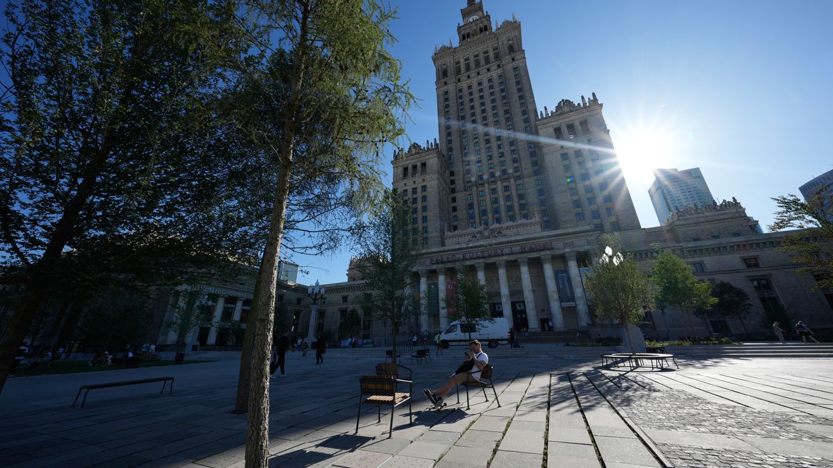 People are seen relaxing in the newly renovated park on Plac Defilad in central  Warsaw, Poland on 01 July, 2025. (Photo by Jaap Arriens/NurPhoto via Getty Images)