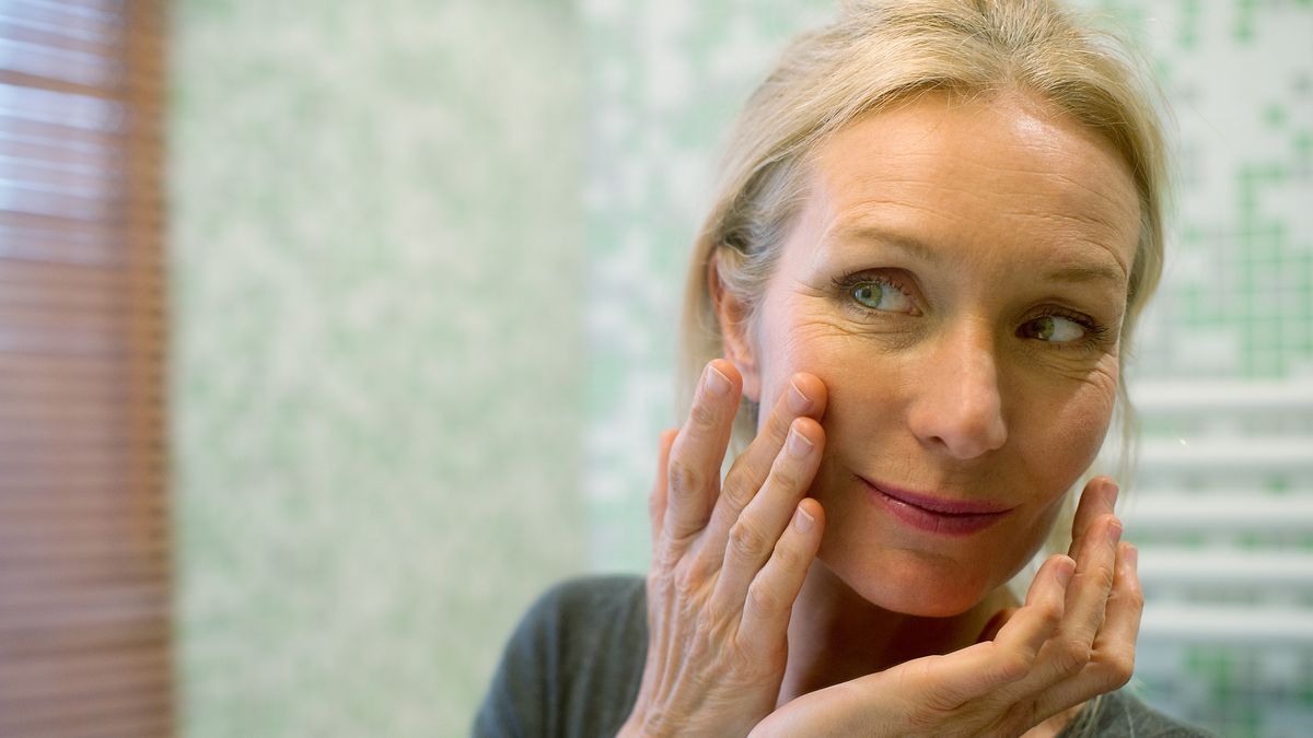Mature woman looking at reflection in mirror with hand on cheek
PhotoAlto/Frederic Cirou
anti-aging, beauty care, blonde, daily life, face, head and shoulders, mature woman, maturity, moisturizing, paris, positive, woman