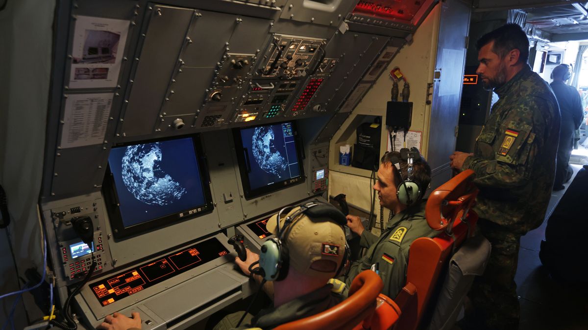 IN FLIGHT - MAY 16: Crew members aboard a P-3C Orion anti-submarine and maritime surveillance plane of the German Navy work at an observation station that includes both radar and photographic capabilities on May 16, 2023 over the Baltic Sea. The German Navy is flying surveillance missions over the North Sea and the Baltic Sea as part of a NATO effort to monitor ships in the region, especially Russian military surface ships and submarines. The flights are part of a series of land, air and sea missions under a NATO initiative called Assurance Measures (AM) along and around its eastern flank. (Photo by Sean Gallup/Getty Images)