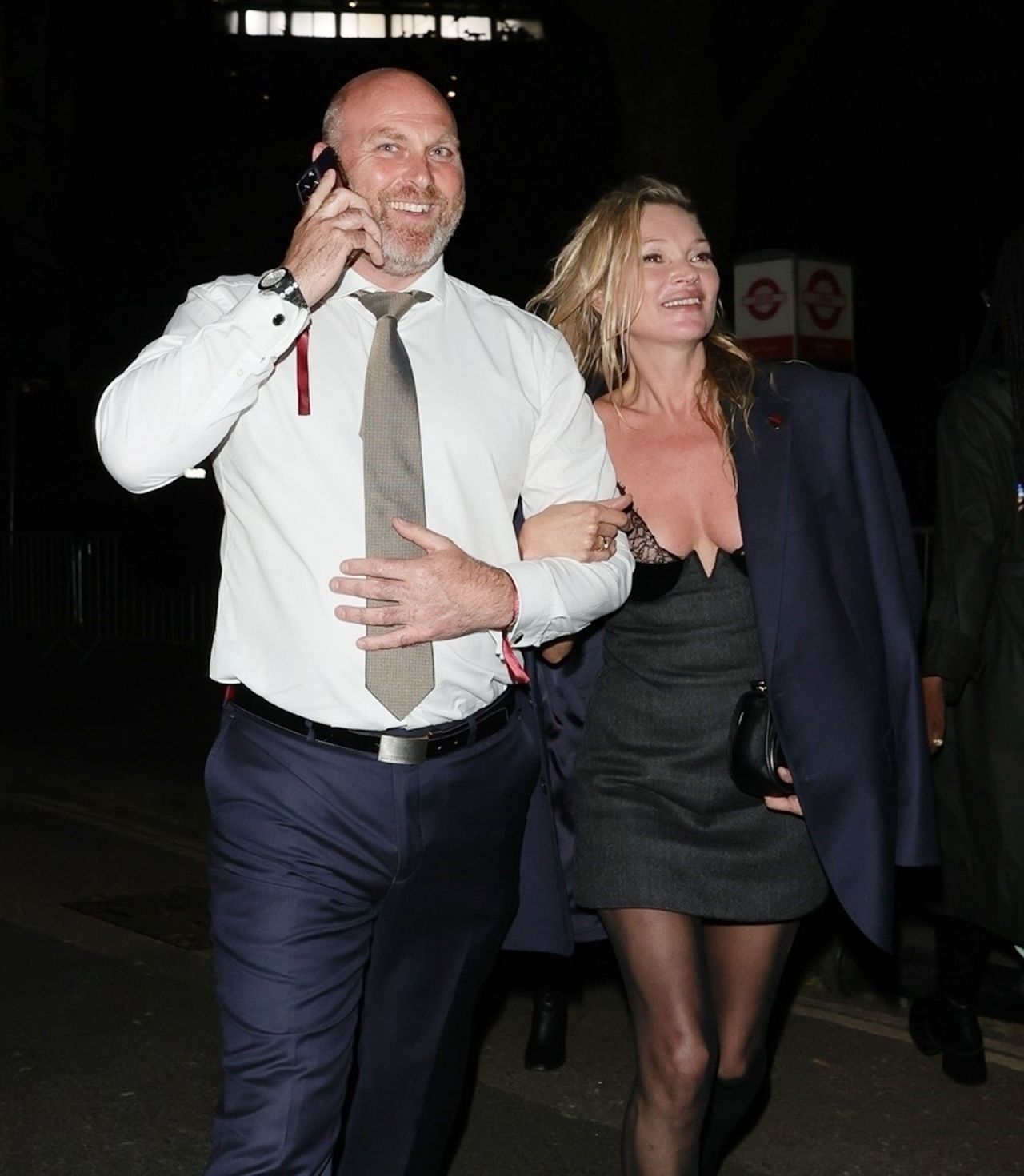 Kate Moss comes out of the Gucci after party laughing.