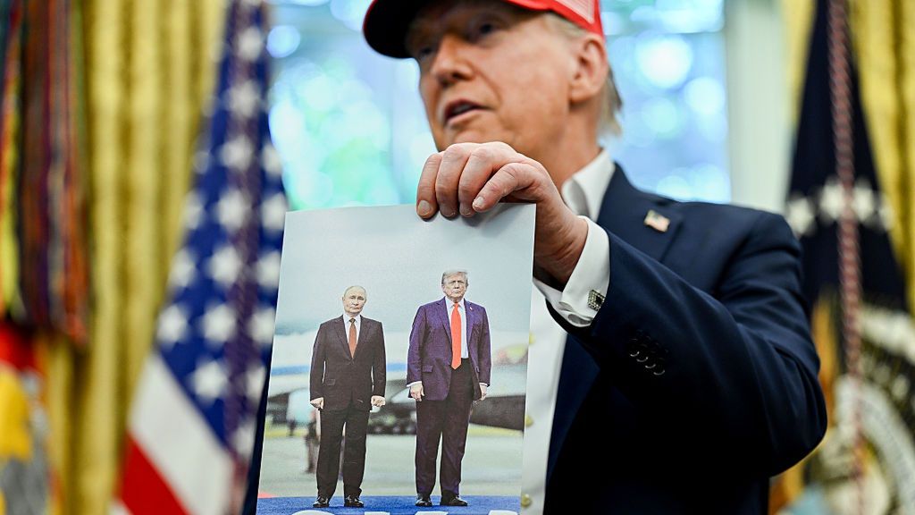 Trump Announces Kennedy Center To Host 2026 World Cup Draw
US President Donald Trump holds a photo of himself with Russian President Vladimir Putin in Alaska, while speaking in the Oval Office of the White House in Washington, DC, US, on Friday, Aug. 22, 2025. Trump announced that Washington's John F. Kennedy Center for the Performing Arts will host the draw for the 2026 FIFA World Cup. Photographer: Annabelle Gordon/UPI/Bloomberg via Getty Images
Bloomberg
north american, us, united states of america, the white house, americas, government news, 2025uspolitics, best photos, u.s.a., american, best photo, u.s. government