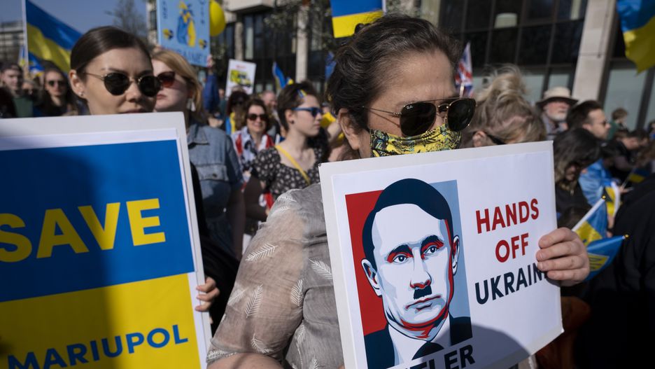 Image of Russian president Vladimir Putin described as a Hitler loving figure as thousands of people gather in the capital for a peace march London stands with Ukraine in solidarity with the people of Ukraine on 26th March 2022 in London, United Kingdom. The conflict in Ukraine is now in its second month and their president has called for people across the World to unite in protest at the Russian invasion and ongoing war in the region. The Ukrainian flag of yellow and blue was everywhere to be seen in this colourful show of unity. (photo by Mike Kemp/In Pictures via Getty Images)