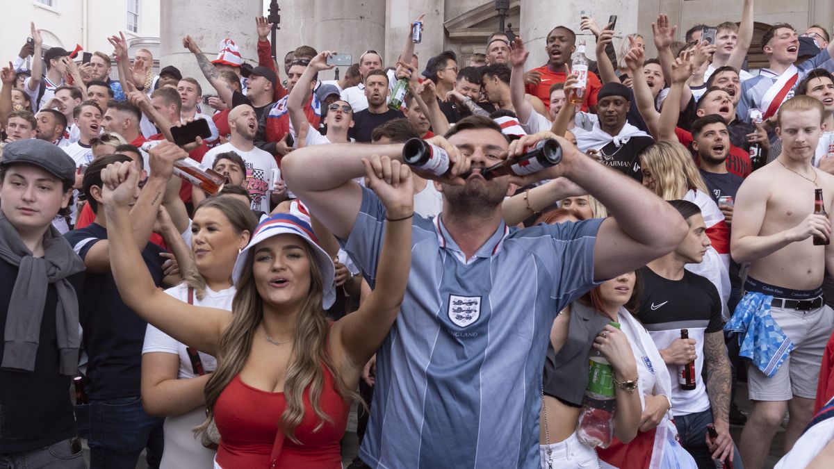 Hours before the England football team play an historic game against Italy the first time since 1966 that the English national team have played in a major mens' international football final, thousands of mainly young male supporters crowd without face coverings nor social distancing in Trafalgar Square, on 11th July 2021, in London, England. (Photo by Richard Baker / In Pictures via Getty Images)