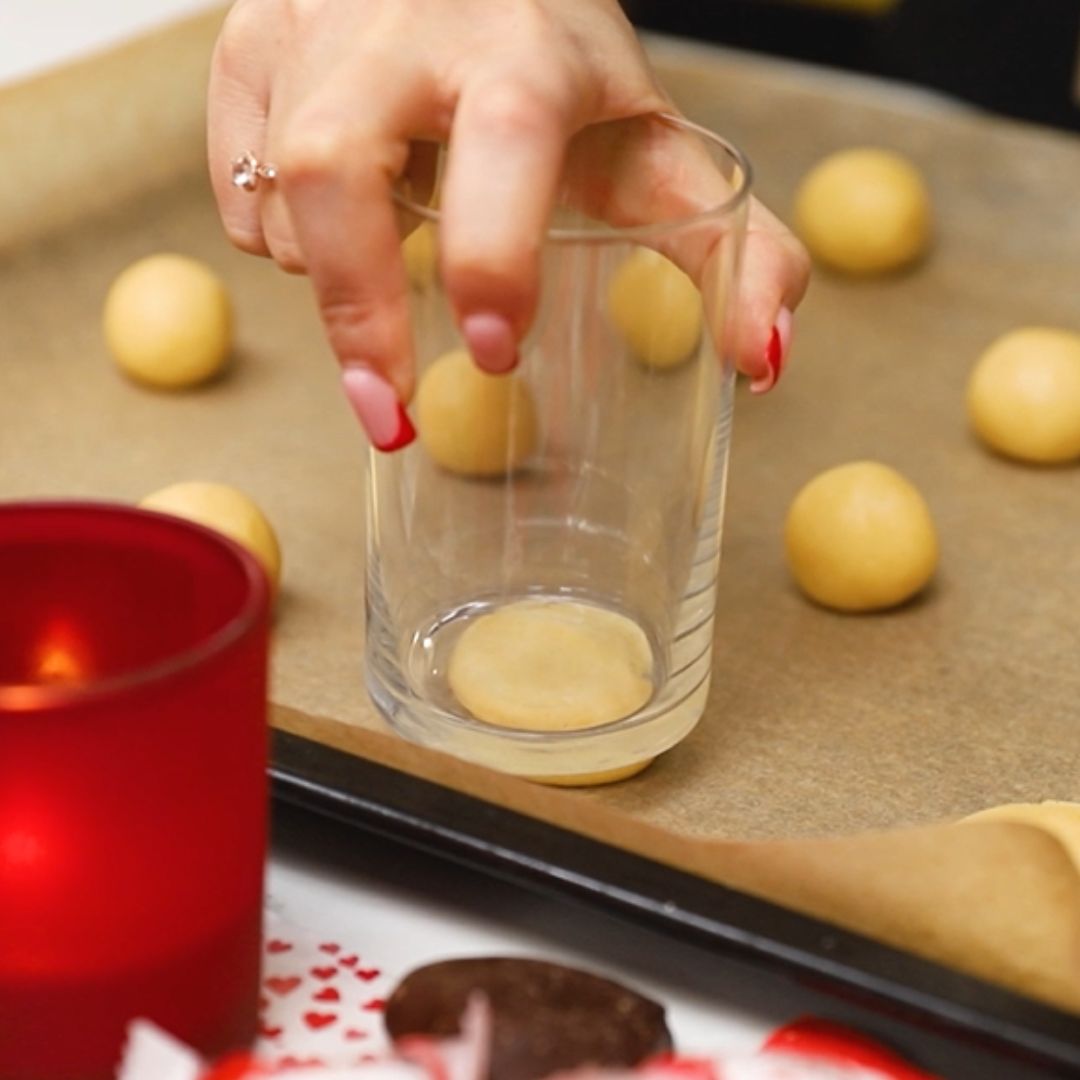 I shape the cookies into the proper shape using a glass.