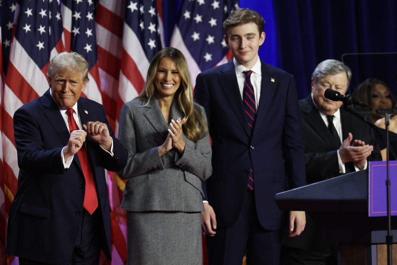 WEST PALM BEACH, FLORIDA - NOVEMBER 06:  Republican presidential nominee, former U.S. President Donald Trump dances on stage with former first lady Melania Trump and Barron Trump during an election night event at the Palm Beach Convention Center on November 06, 2024 in West Palm Beach, Florida. Americans cast their ballots today in the presidential race between Republican nominee former President Donald Trump and Vice President Kamala Harris, as well as multiple state elections that will determine the balance of power in Congress.   (Photo by John Moore/Getty Images)