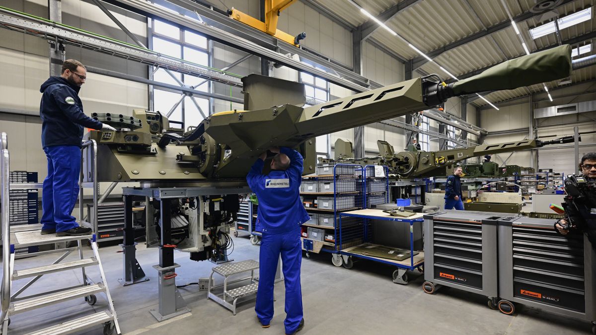 UELZEN, GERMANY - FEBRUARY 12: Employees work at a production line as German Chancellor Olaf Scholz and Defence Minister Boris Pistorius attend the groundbreaking ceremony for a new munitions factory of German defence contractor Rheinmetall on February 12, 2024 in Unterluess, Germany. The war in Ukraine has been a boon to Rheinmetall as Germany seeks to provide Ukraine with munitions, including artillery shells, and also increase its own supply. (Photo by Fabian Bimmer - Pool/Getty Images)