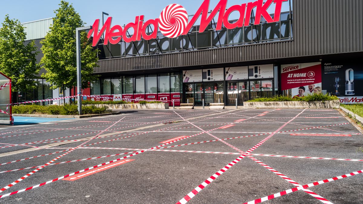 The entrance of Media markt with stickers to help people keep their distance in Oostakker, Belgium on May 9, 2020. Belgium will start phase two with the opening of shops allowing more people to work again  on condition. Belgium start cautiously  with a way out of the corona measures. Stores will  reopen again on May 11 under certain conditions. (Photo by Jonathan Raa/NurPhoto via Getty Images)