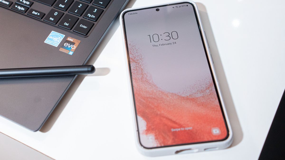 A Samsung Galaxy S22 smartphone and a Galaxy Book 2 Pro 360 laptop-to-tablet with S Pen during the Samsung Galaxy Mobile World Congress (MWC) 2022 event in New York, U.S., on Thursday, Feb. 24, 2022. Last year, Samsung reached more PC consumers in more markets than ever before, as a result, PC sales increased by 63 percent year-over-year. Photographer: Jutharat Pinyodoonyachet/Bloomberg via Getty Images