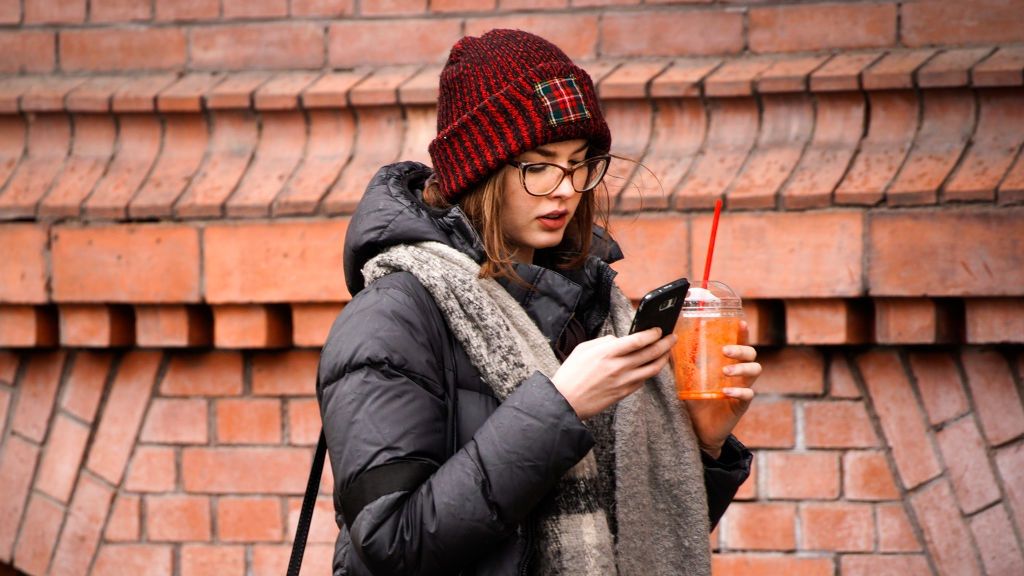 Daily Life In Poland
A woman is seen handling her mobile phone while walking holding a drink in Bydgoszcz, Poland on March 8, 2019. (Photo by Jaap Arriens/NurPhoto via Getty Images)
NurPhoto
cold, data, distracted, distraction, drink, glasses, hat cap, jacket, multitasking, phone, smartphone, social media, tech, techonlogy, walking, winter, woman, young, youth