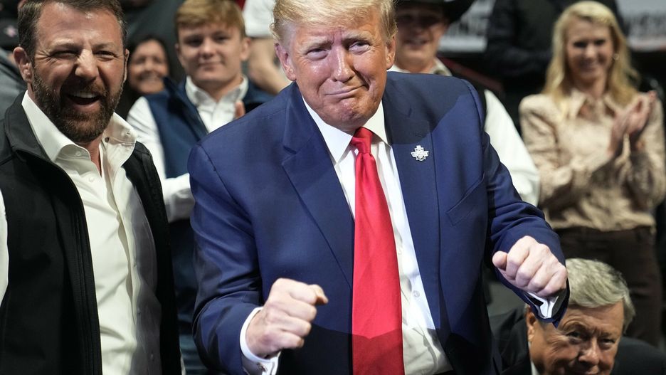Temporary
Former President Donald J. Trump gestures to Vito Arujau, NCAA wrestling champion at the 133 lb class, at the NCAA Wrestling Championships, Saturday, March 18, 2023, in Tulsa, Okla. At left if U.S. Sen. Markwayne Mullin. (AP Photo/Sue Ogrocki)
Sue Ogrocki