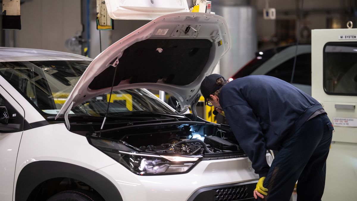 A worker inspects the engine bay of a Toyota Aygo X hybrid vehicle on the Toyota Motor Manufacturing Czech Republic s.r.o.'s production line in Kolin, Czech Republic, on Monday, Feb. 2, 2026. Toyota kept its title as the world's biggest carmaker for a sixth year, widening its lead over Volkswagen AG by posting record sales despite trade turmoil and growing competition. Photographer: Milan Jaros/Bloomberg via Getty Images