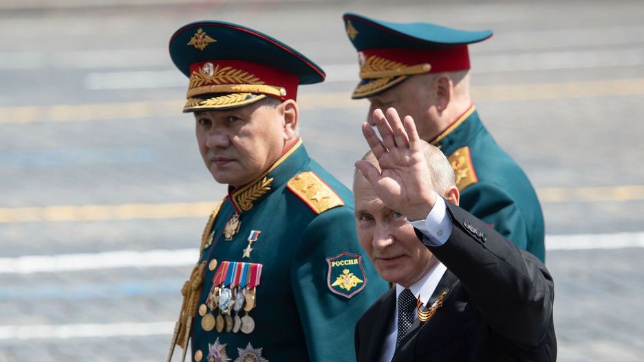 TemporaryRussian President Vladimir Putin and Defence Minister Sergei Shoigu leave Red Square after a military parade, which marks the 75th anniversary of the Soviet victory over Nazi Germany in World War Two, in Moscow on June 24, 2020. - The parade, usually held on May 9, was postponed this year because of the coronavirus pandemic. (Photo by Pavel Golovkin / POOL / AFP)PAVEL GOLOVKIN