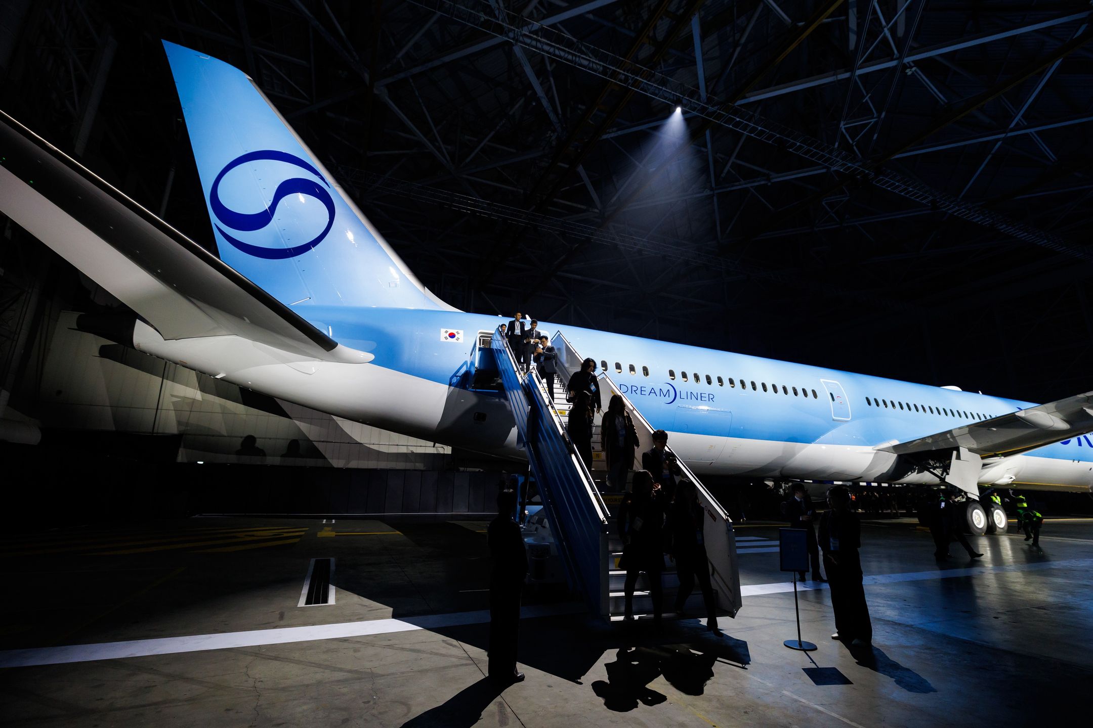 A Boeing Co. 787-10 Dreamliner aircraft in new Korean Air Lines Co Ltd. livery at Gimpo International Airport in Seoul, South Korea, on Tuesday, March 11, 2025. Korean Air unveiled a new corporate logo and aircraft livery as part of a wide-ranging brand refresh following its acquisition of local rival Asiana Airlines Inc. that has created Asias second-biggest airline group. Photographer: SeongJoon Cho/Bloomberg via Getty Images