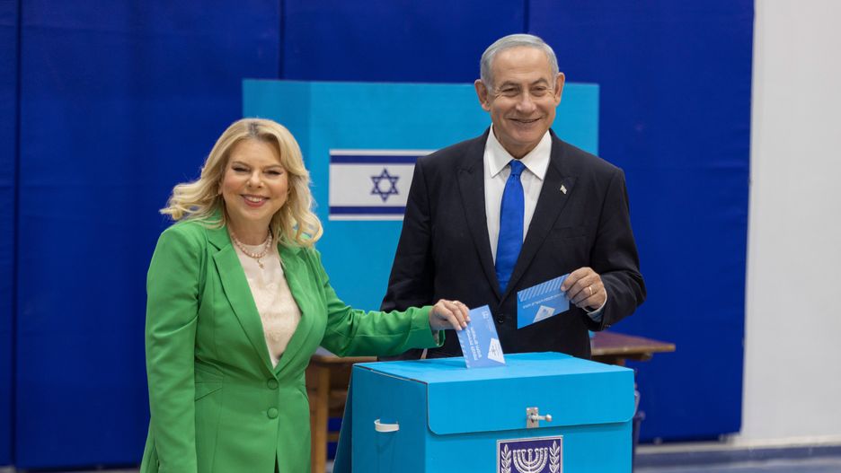 Benjamin Netanyahu, leader of the Likud party, right, and his wife Sara Netanyahu cast their ballots at a polling station in Jerusalem, Israel, on Tuesday, Nov. 1, 2022. Israelis began voting on Tuesday in their fifth general election since 2019, with former Prime Minister Netanyahu plotting his return as part of an alliance that could empower the nations far right Photographer: Kobi Wolf/Bloomberg via Getty Images