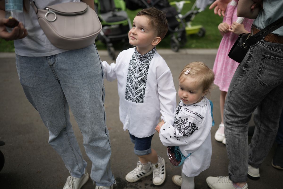 BUCHA, UKRAINE - JUNE 01: Children in Bucha wear traditional dress as they take part in events to mark Children's Day on June 01, 2022 in Bucha, Ukraine. Bucha and neighbouring Irpin are still recovering from the devastation of the Russian invasion towards Kyiv. Children's Day, a celebration in honour of the welfare of children, is observed on June 1 in most post-Communist and Communist countries. In many other countries, World Children's Day is observed on November 20, marking the Declaration of the Rights of the Child by the UN General Assembly on that day in 1959. (Photo by Christopher Furlong/Getty Images)