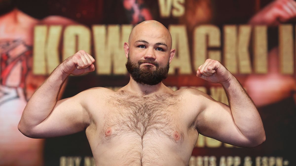 LAS VEGAS, NEVADA - OCTOBER 08:  Adam Kownacki poses on the scale during his official weigh-in at MGM Grand Garden Arena on October 8, 2021 in Las Vegas, Nevada.  Kownacki will fight Adam Kownacki Robert Heleniuson October 9 at T-Mobile Arena in Las Vegas. (Photo by Al Bello/Getty Images)