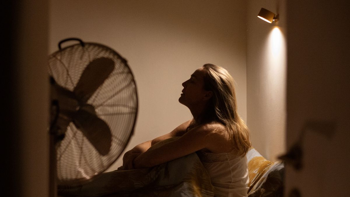 Sleepless woman sitting up in bed at night
Kathrin Ziegler