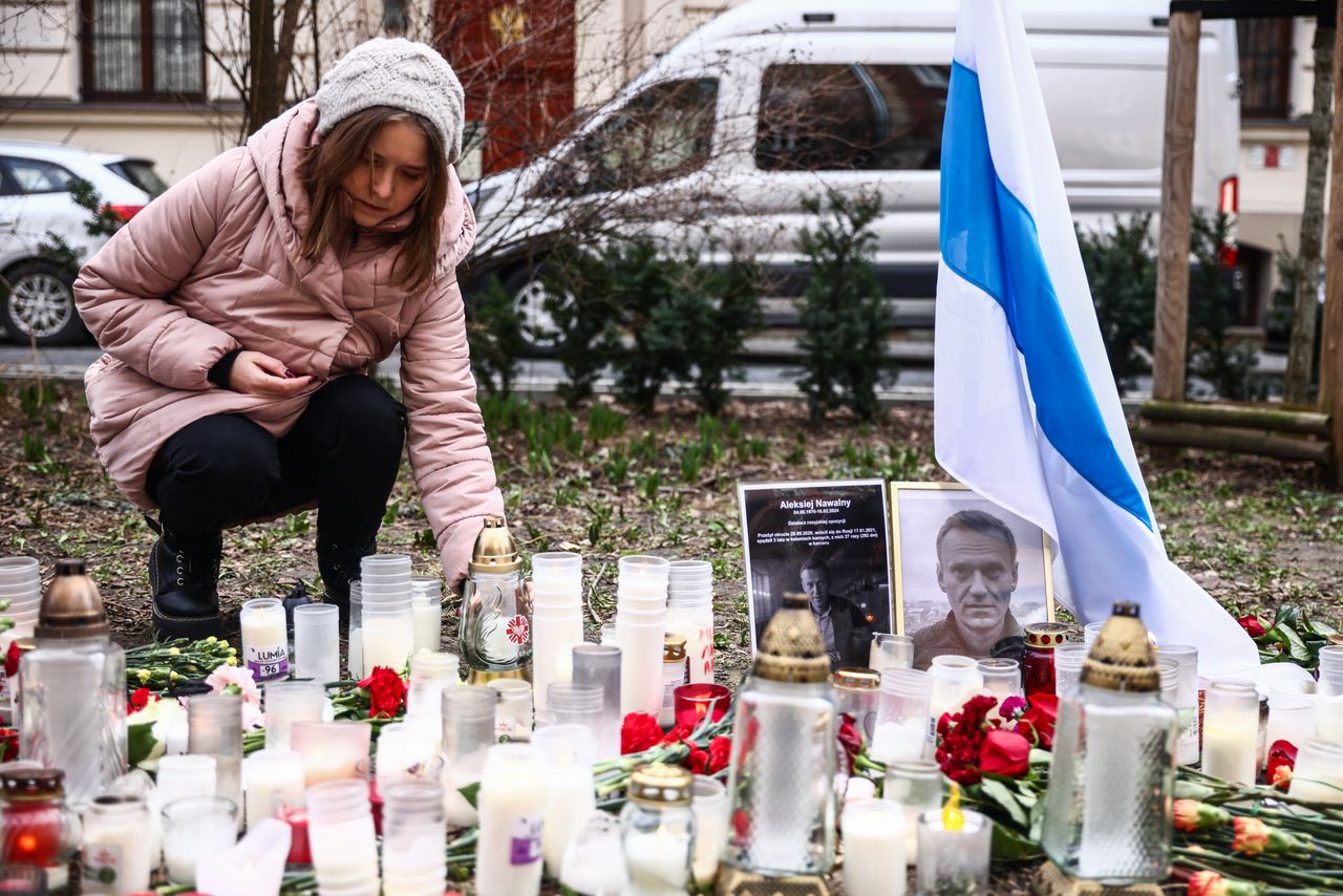 People light candles in tribute to Alexiei Navalny in front of the Russian Consulate General in Krakow, Poland on February 18, 2024. Navalny, 47, Russian opposition politician, died two days before in the Russian prison about 40 miles north of the Arctic Circle, where he had been sentenced to 19 years. (Photo by Beata Zawrzel/NurPhoto via Getty Images)