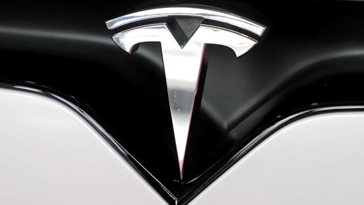 BARI, ITALY - FEBRUARY 28: Tesla symbol at the BTM Tourism Fair 2024 on February 28, 2024 in Bari, Italy. BTM tourism fairs 2024 in Bari, in the spaces of the Fiera del Levante, Business Tourism Management is the event made in Puglia for the promotion of tourism in Southern Italy, bringing together operators, buyers, sellers, administrations, businesses, public bodies and private individuals, companies and important speakers. (Photo by Donato Fasano/Getty Images)