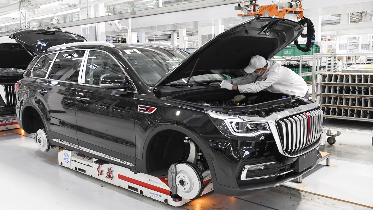 CHANGCHUN, CHINA - DECEMBER 11, 2022 - The Red Flag workshop uses neat and bright white hues in Changchun, Jilin province, China, Nov 11, 2022. This new factory of Hongqi Manufacturing Department, transformed from the old industrial base of FAW, has three main production lines, with a total construction area of 19,300 square meters and a standard annual production capacity of 62,000 units. It is mainly responsible for the final assembly of Hongqi H7 luxury cars and HS7 high-end SUVs, gathering the product essence of the new Hongqi brand. This assembly workshop, only 129 front-line workers can easily run, intelligent station accounts for more than 80% of the total number of stations. A digital control platform is operated by a master worker who guides a ton of automated robots to assemble components such as engines, chassis, tires and doors in stages. At the same time, the components of the instrument panel assembly line are also unmanned, automatic intelligent distribution system, orderly intelligent delivery, greatly improving the production efficiency and order. (Photo credit should read CFOTO/Future Publishing via Getty Images)