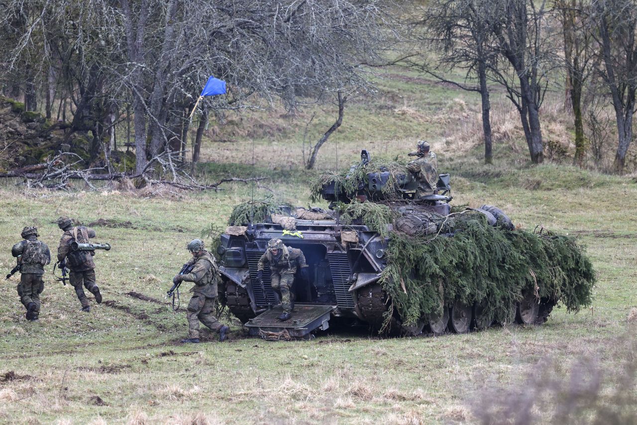 Soldiers of the German Bundeswehr secure an area with a Marder infantry fighting vehicle (IFV) during an Allied Spirit 24 multinational training exercise at the Hohenfels Training Area in Hohenfels, Germany, on Saturday, March 16, 2024. Allied Spirit 24 is a U.S. Army exercise for its NATO allies and partners, with participants from countries including Croatia, Denmark, Germany, Hungary, Italy, Lithuania, Netherlands, Spain, the UK and the US. Photographer: Alex Kraus/Bloomberg via Getty Images