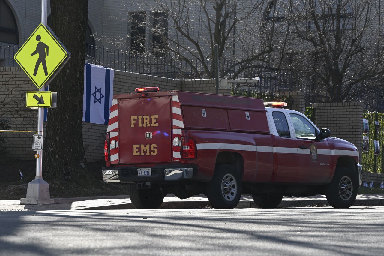WASHINGTON D.C., UNITED STATES - FEBRUARY 25: Police take security measures and investigate the crime scene after a man set himself alight in front of the Israeli Embassy in Washington, United States on February 25, 2024. The man was subsequently referred to a regional hospital in critical condition due to serious injuries. (Photo by Celal Gunes/Anadolu via Getty Images)