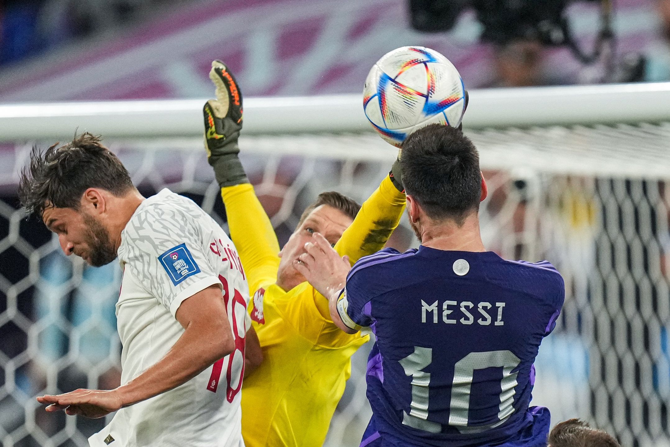 (1) SZCZESNY Wojciech goalkeeper of team Poland defend the ball and hit head (10) MESSI Lionel of team Argentina battle for ball with  during the FIFA World Cup Qatar 2022 Group C match between Poland and Argentina at Stadium 974 on 30 November 2022 in Doha, Qatar.  (Photo by Ayman Aref/NurPhoto via Getty Images)